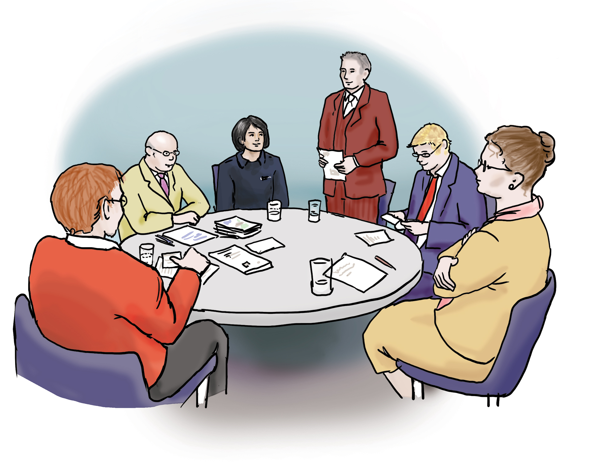 Eine Personengruppe an einem runden Tisch