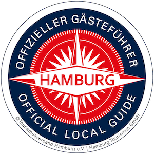 Offizielles Logo der Hamburger Gästeführer, kreisrund in denn Farben weiß, schwarz und rot mit dem Hamburgschriftzug und einer Windrose
