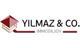 Yilmaz & Co. Immobilien Logo, schwarze und graue Schrift auf weißem Untergrund