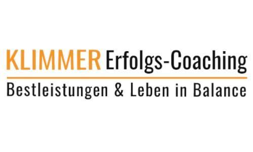 Klimmer Erfolgs-Coaching Logo, orange und schwarze Schrift auf weißem Untergrund