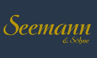 Seemann & Söhne KG Logo, gelbe Schrift auf dunkelblauem Untergrund