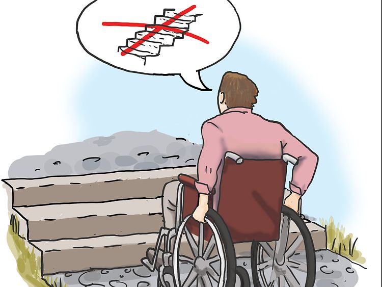  Mann im Rollstuhl steht vor einer Treppe
